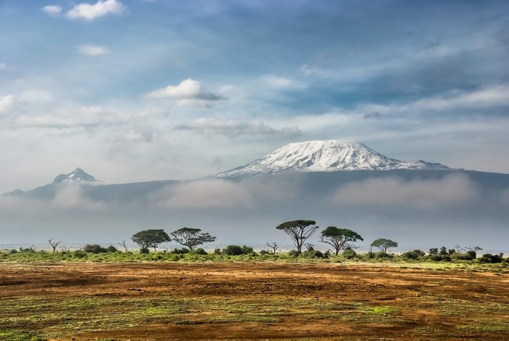 Kilimanjaro poking its head above the clouds. Photo: Getty.