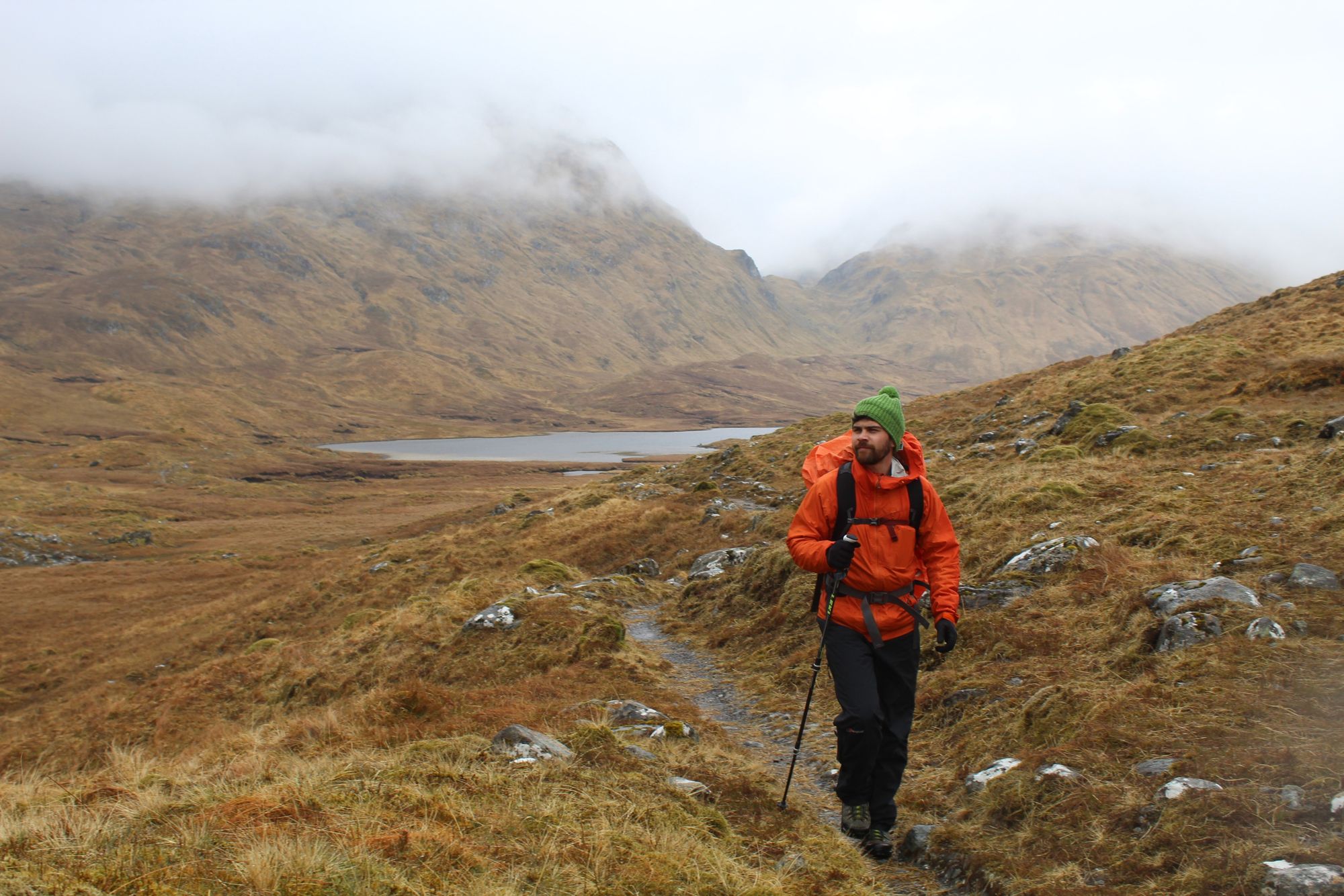 The author hiking up from Loch a' Bhealach towards Glen Affric Youth Hostel, as clouds clear. Photo: Robbie Ambrose