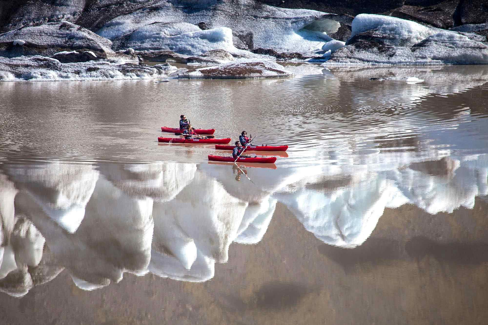 Kayaking across Sólheimajökull Lake. Photo: Icelandic Mountain Guides.