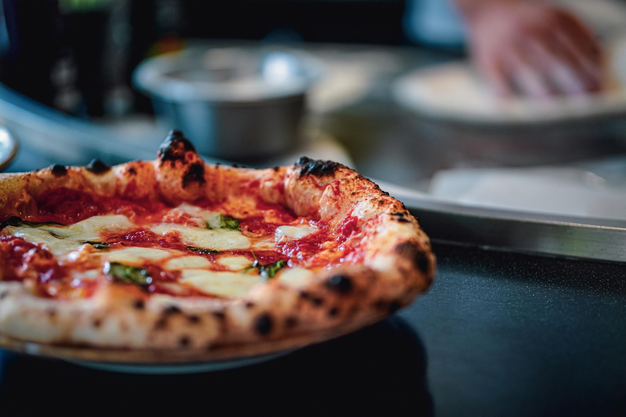 Look out for the Associazione Verace Pizza Napoletana mark if you're eating pizza in Naples. Photo: Getty