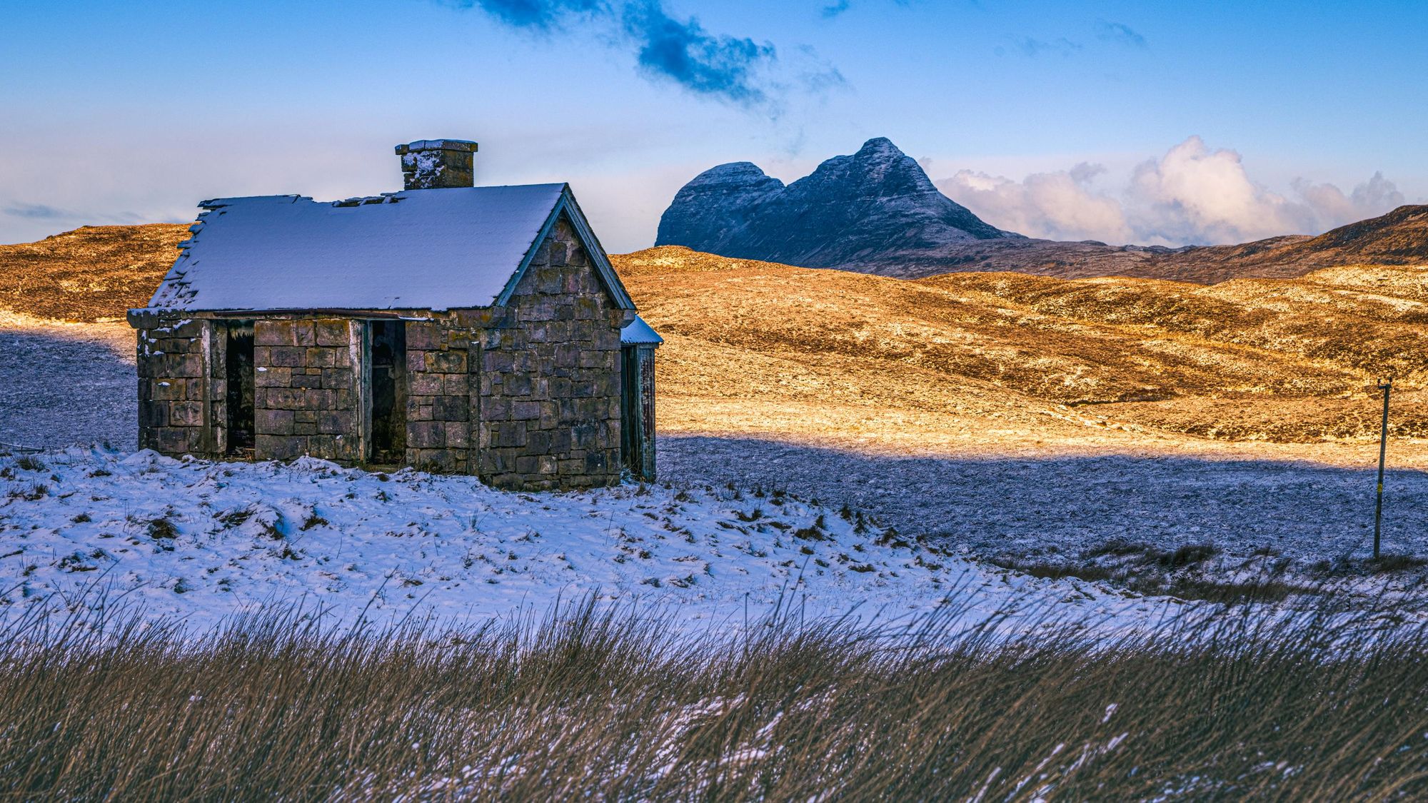 The Elphin bothy in Assynt, Scotland with the mountain Suilven also in the picture. Photo: Getty