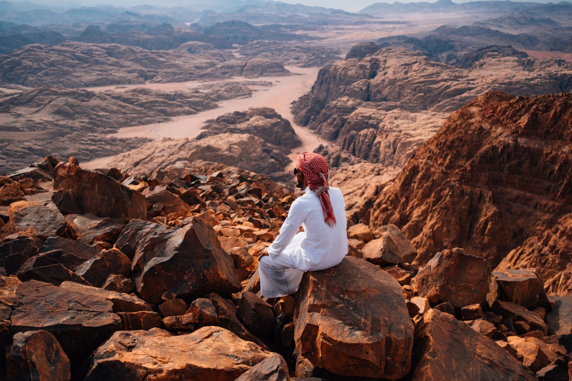 A man looks out over Wadi Rum