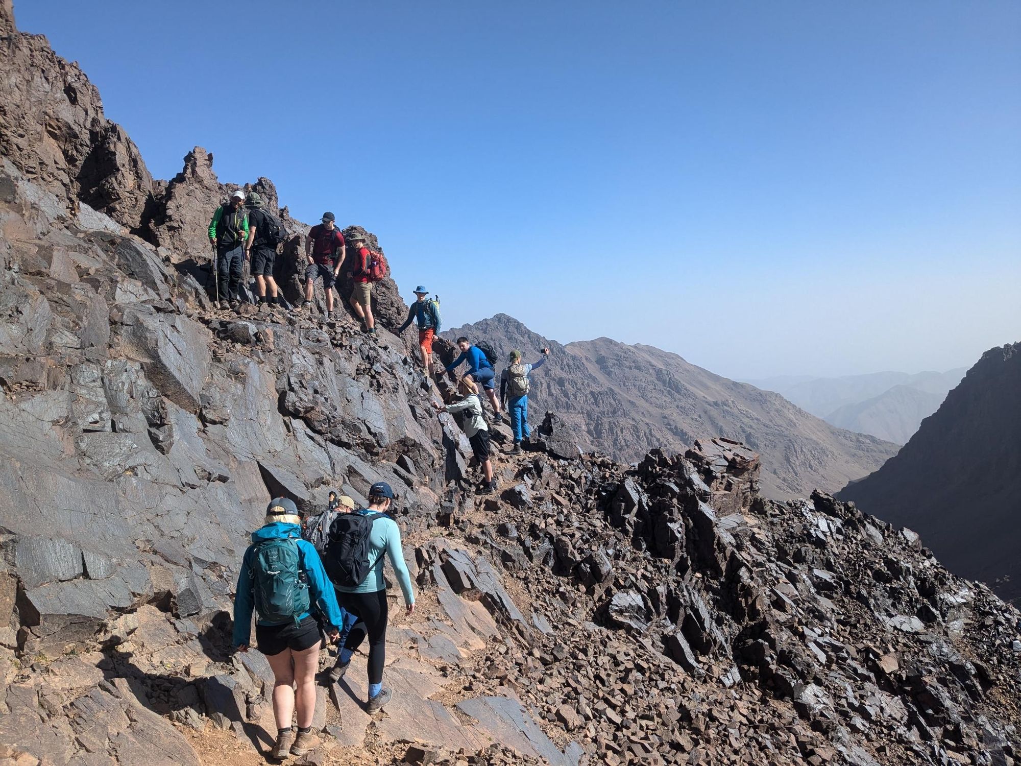 Hikers scramble to the top of Mount Ouanoukrim Ridge. Photo: Dani Redd