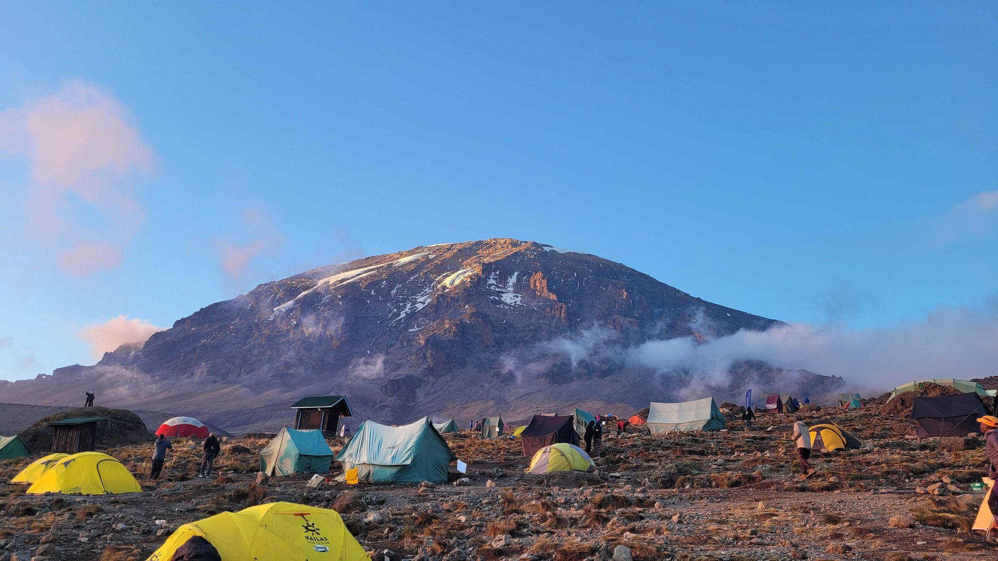 Tents layered just beneath the peak of Mount Kilimanjaro. Photo: Kirsty Holmes