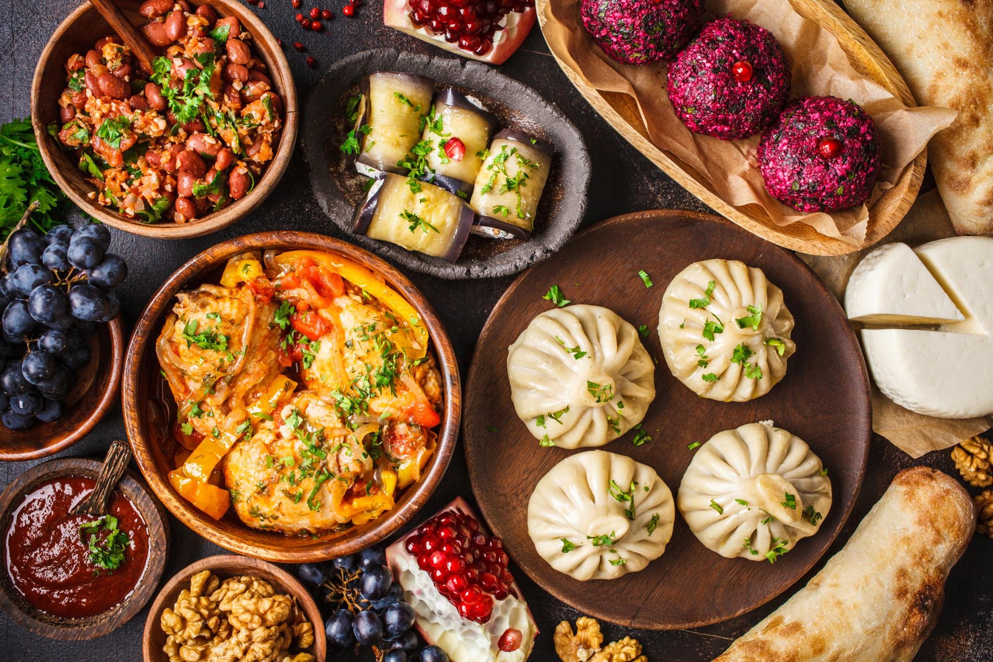 Traditional Georgian cuisine, including khinkali, phali, chahokhbili, lobio, cheese and eggplant rolls. Photo: Getty