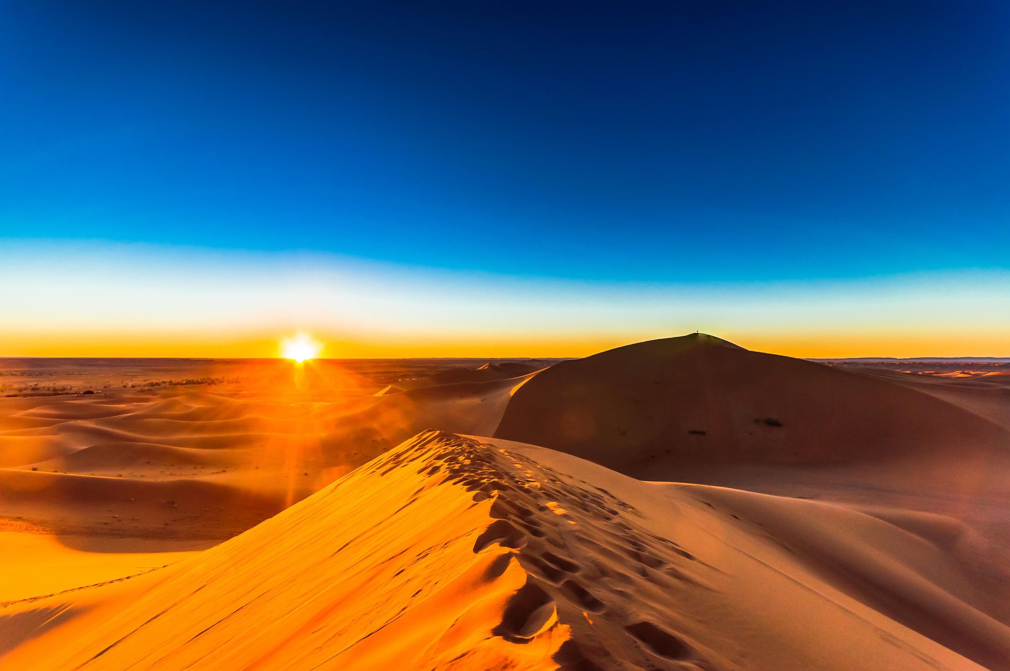 View on sunrise in the Sahara desert next to M'hamid in Morocco. Photo: Getty