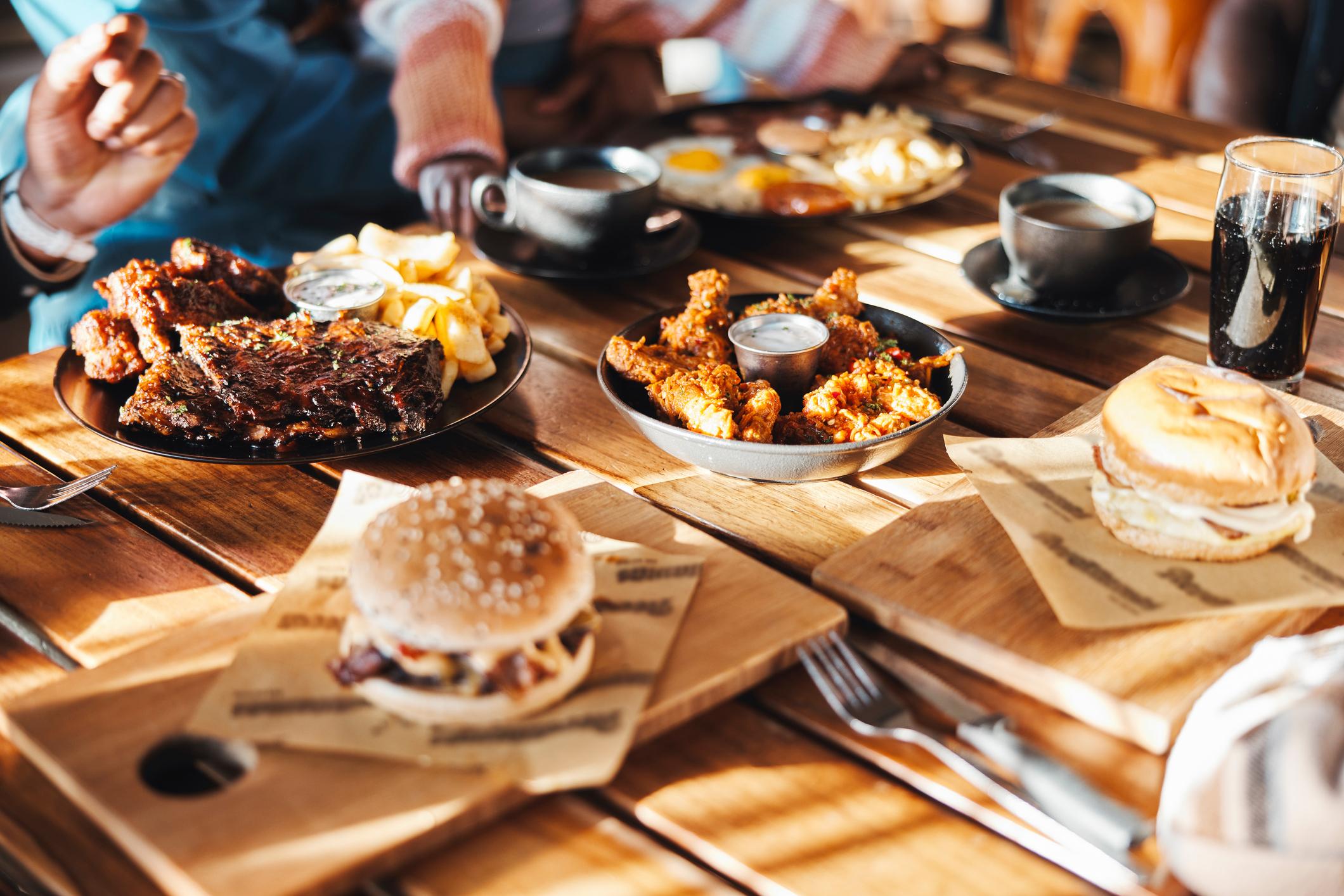 American diner food - burgers, ribs and fried chicken. Photo: Getty.