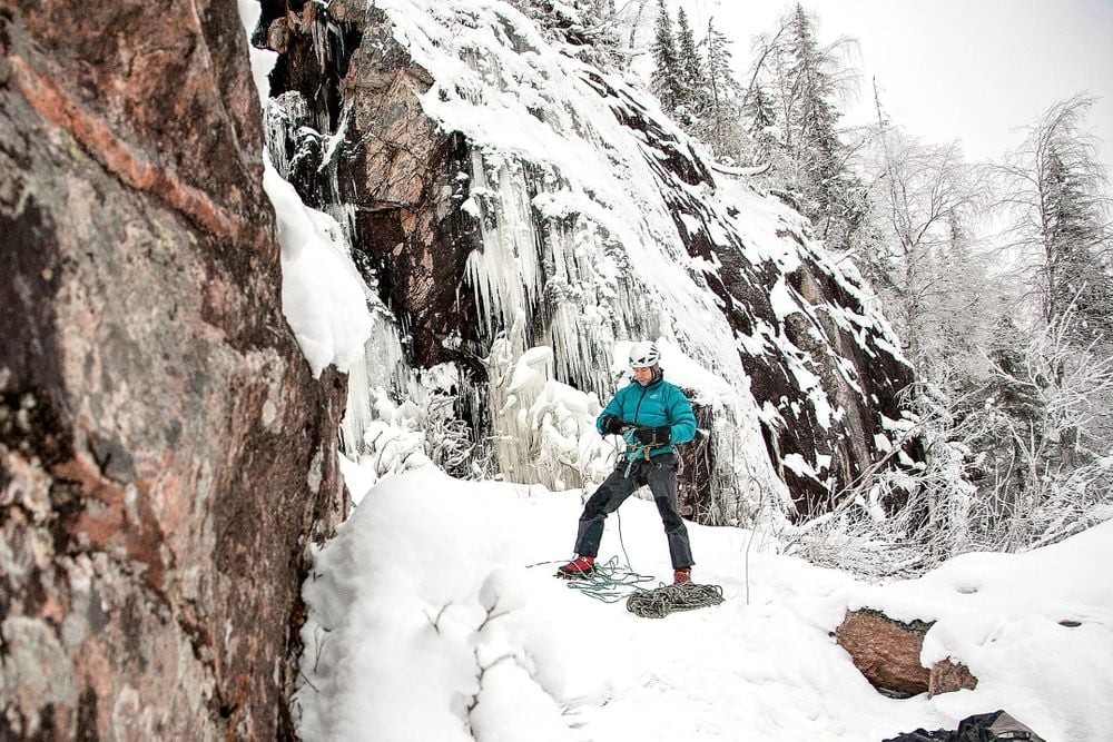 Finnish outdoor guide Artturi Kröger gets ready to ascend a frozen ice fall in Finnish Lapland. Photo: Markus Siivola