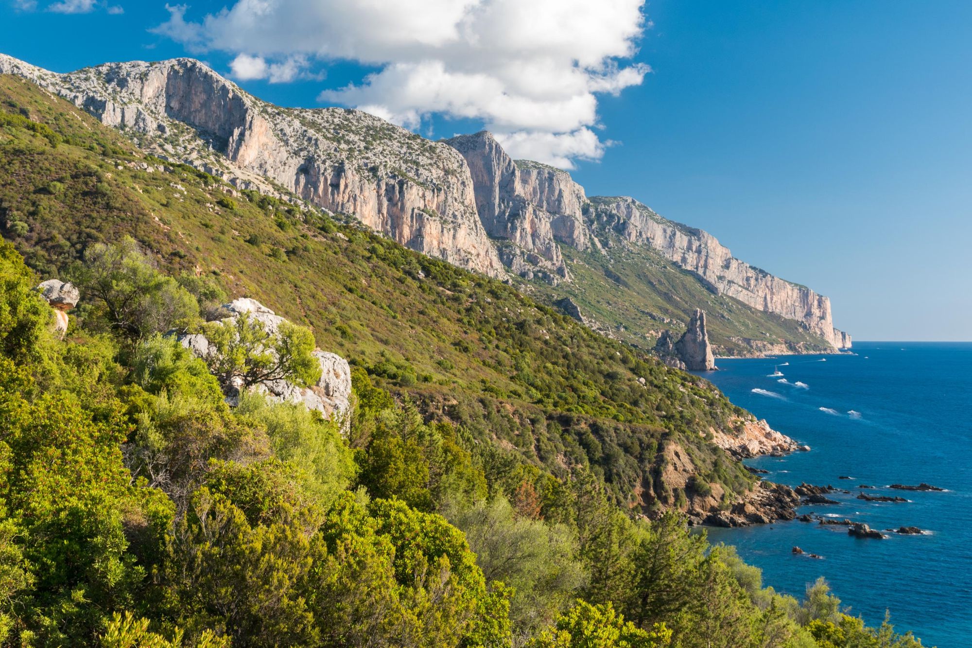 Coastline near Santa Maria Navarrese with rock pinnacle called Pedra Longa in the background (Sardinia, Italy). Photo: Getty