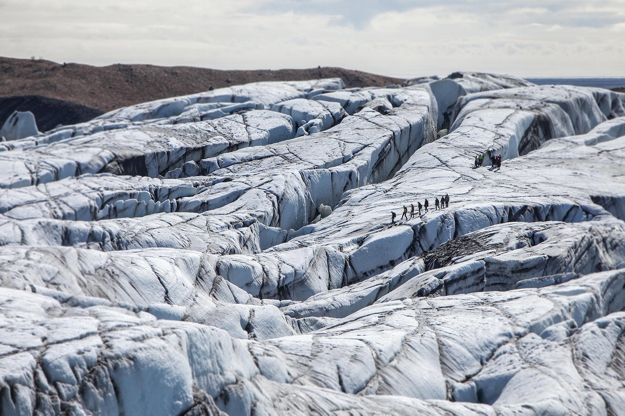 Hikers crossing Sólheimajökull, a glacier in Iceland. Photo: Bjorgin Hilmarsson