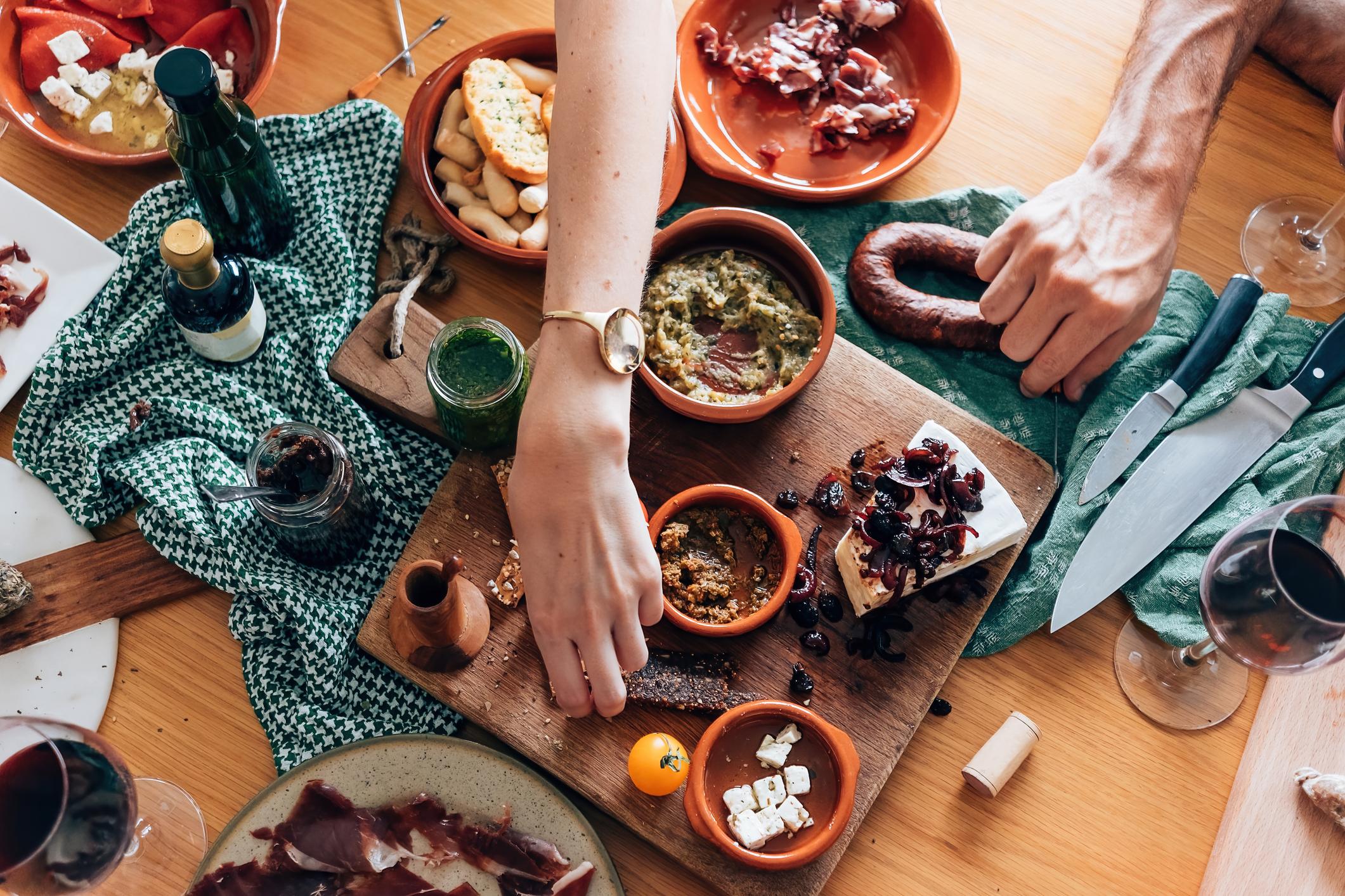 A group of friends sharing tapas together. Photo: Getty.