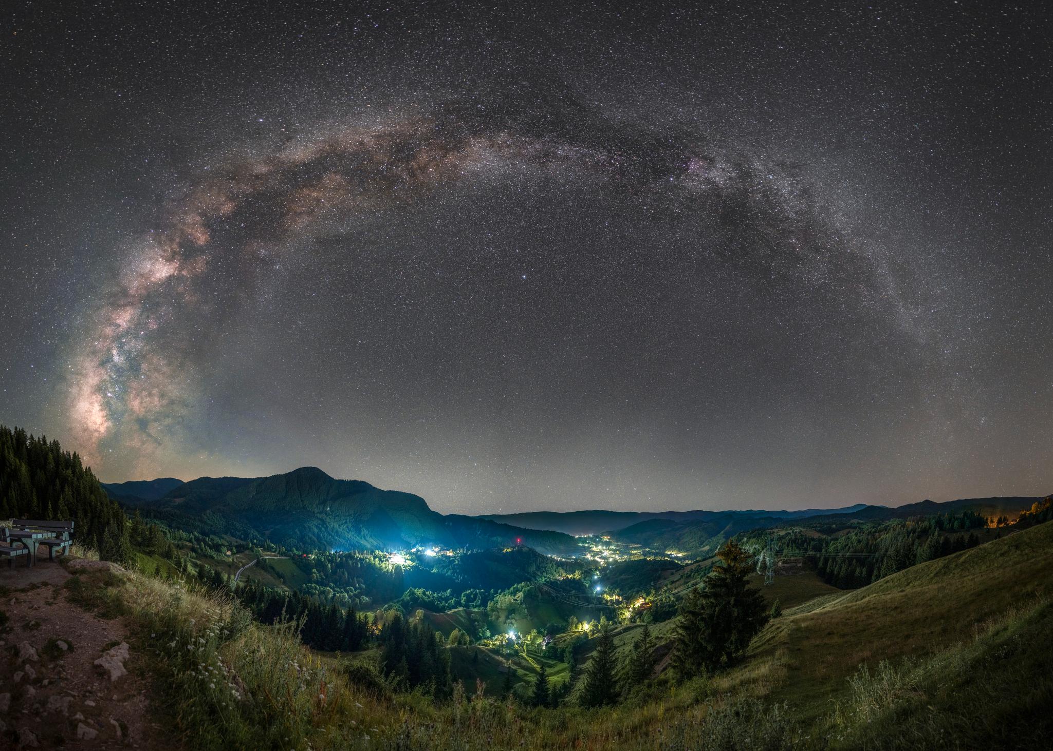 The Milky Way arches over the Carpathian Mountains in Romania. Photo: Getty