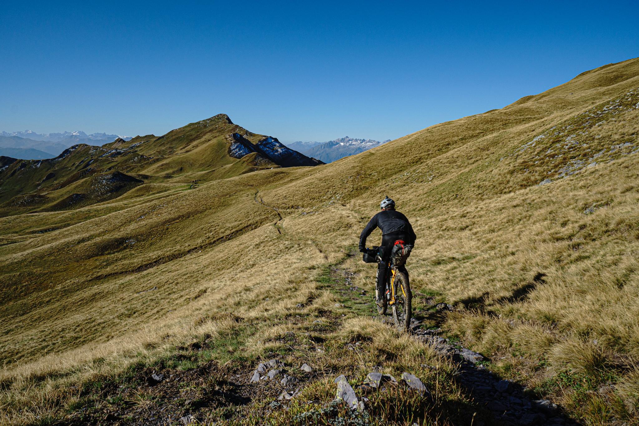 Scotty heads into the mountains on his bike. Photo: Scott Cornish.