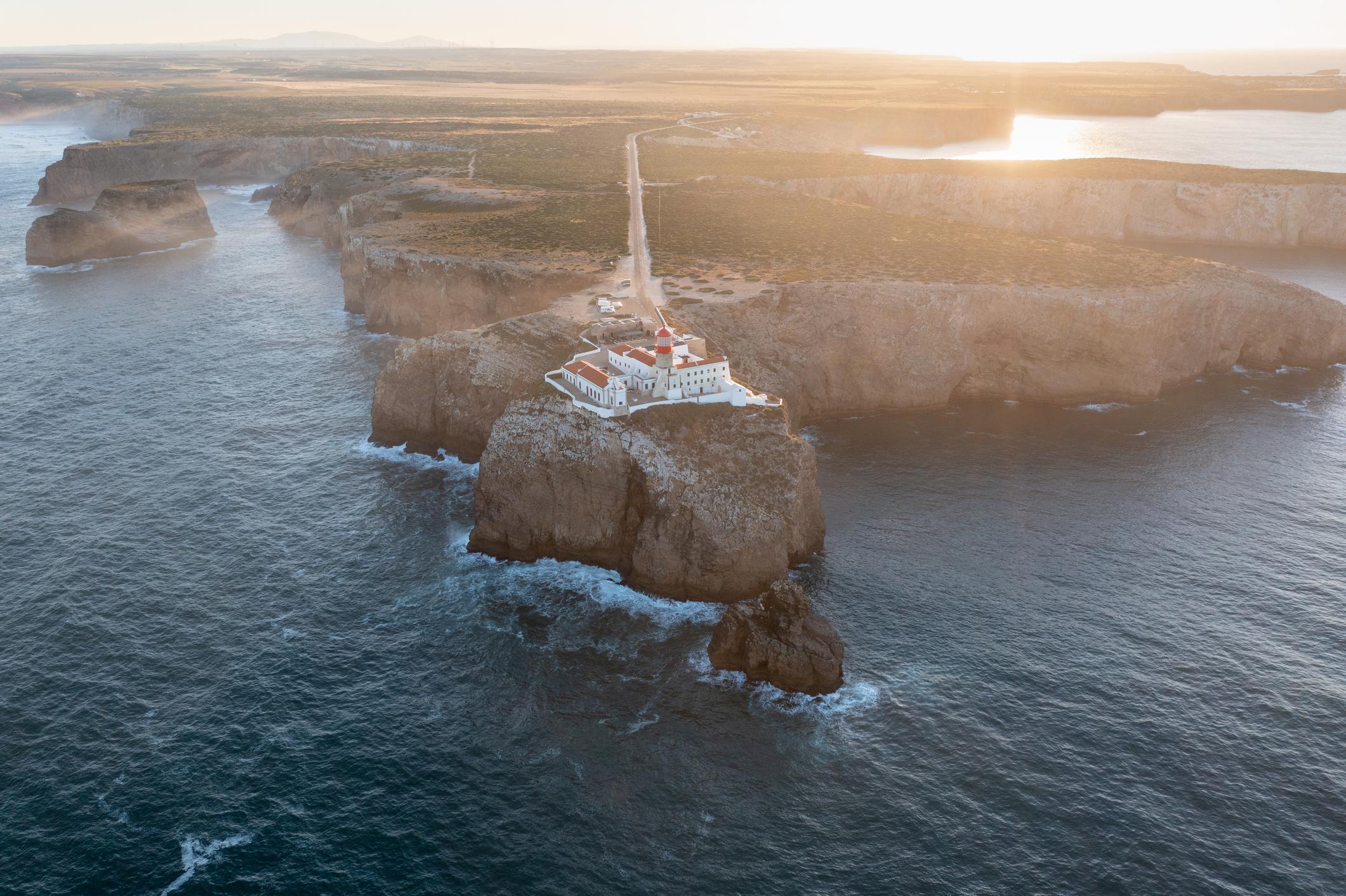 The rugged cliffs of Cabo de São Vicente, with Farol do Cabo de São Vicente lighthouse on the edge. Photo: Getty