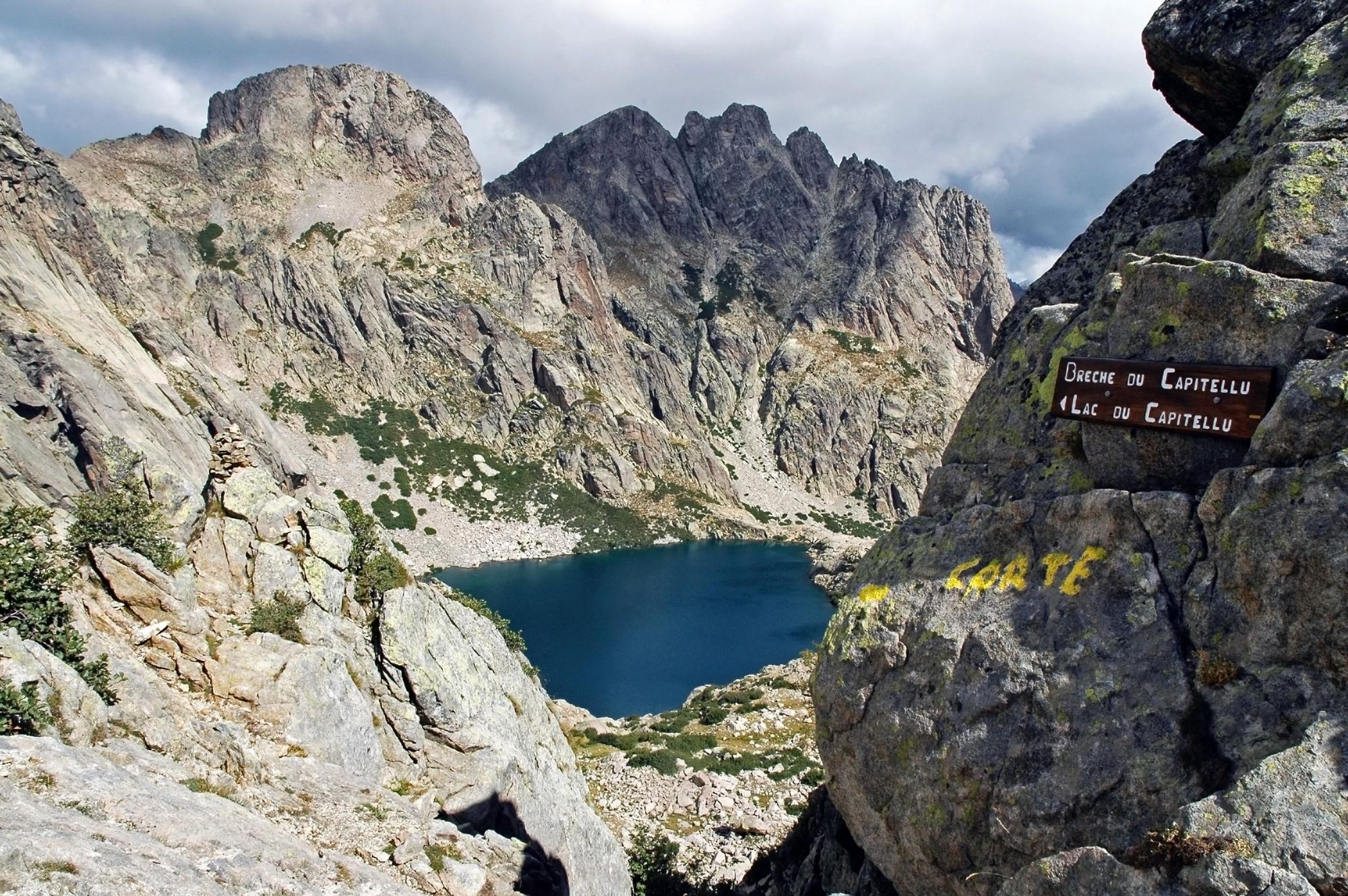 The beautiful Lac de Capitellu (Capitellu lake) on the GR20 trail, hidden away between the rugged mountains. Photo: Getty