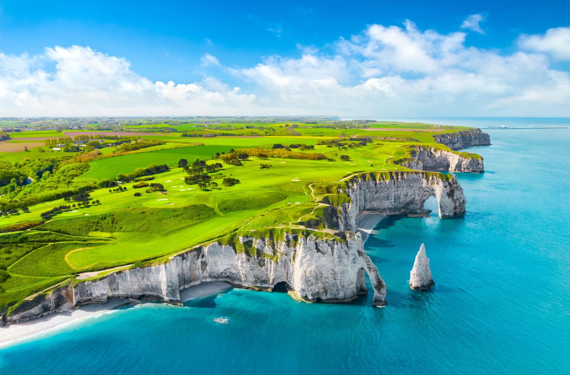 The remarkable colours of Étretat on the Normandy coast on a sunny day. Photo: Getty