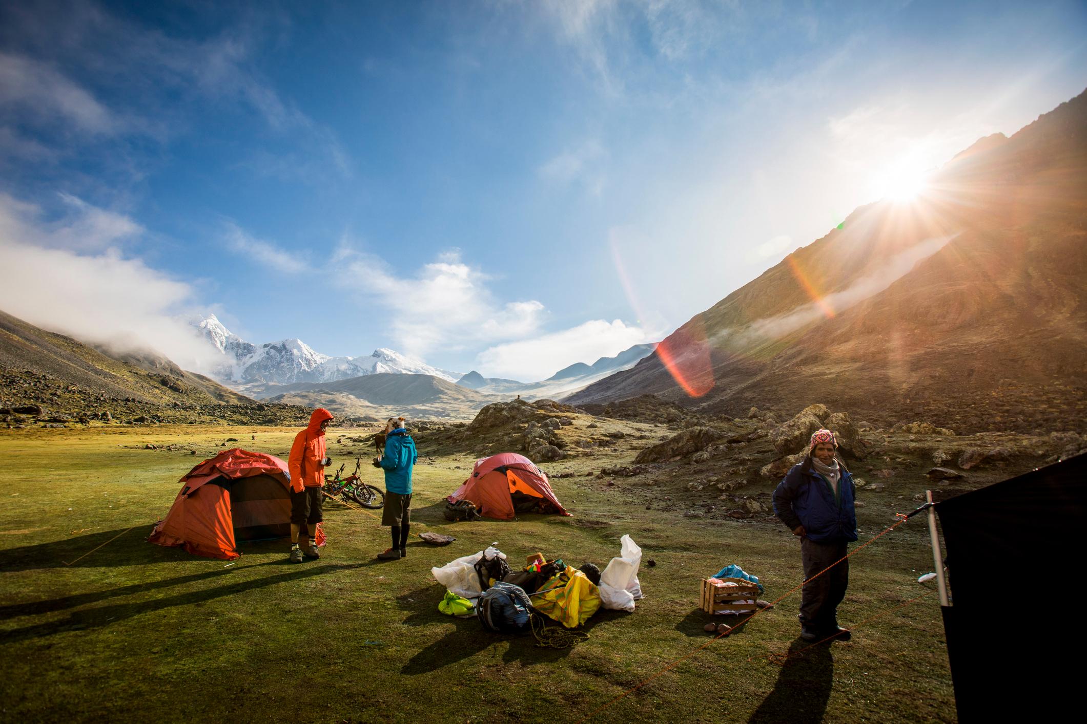 Setting up the tents on a bikepacking trip through Peru. Photo: Getty