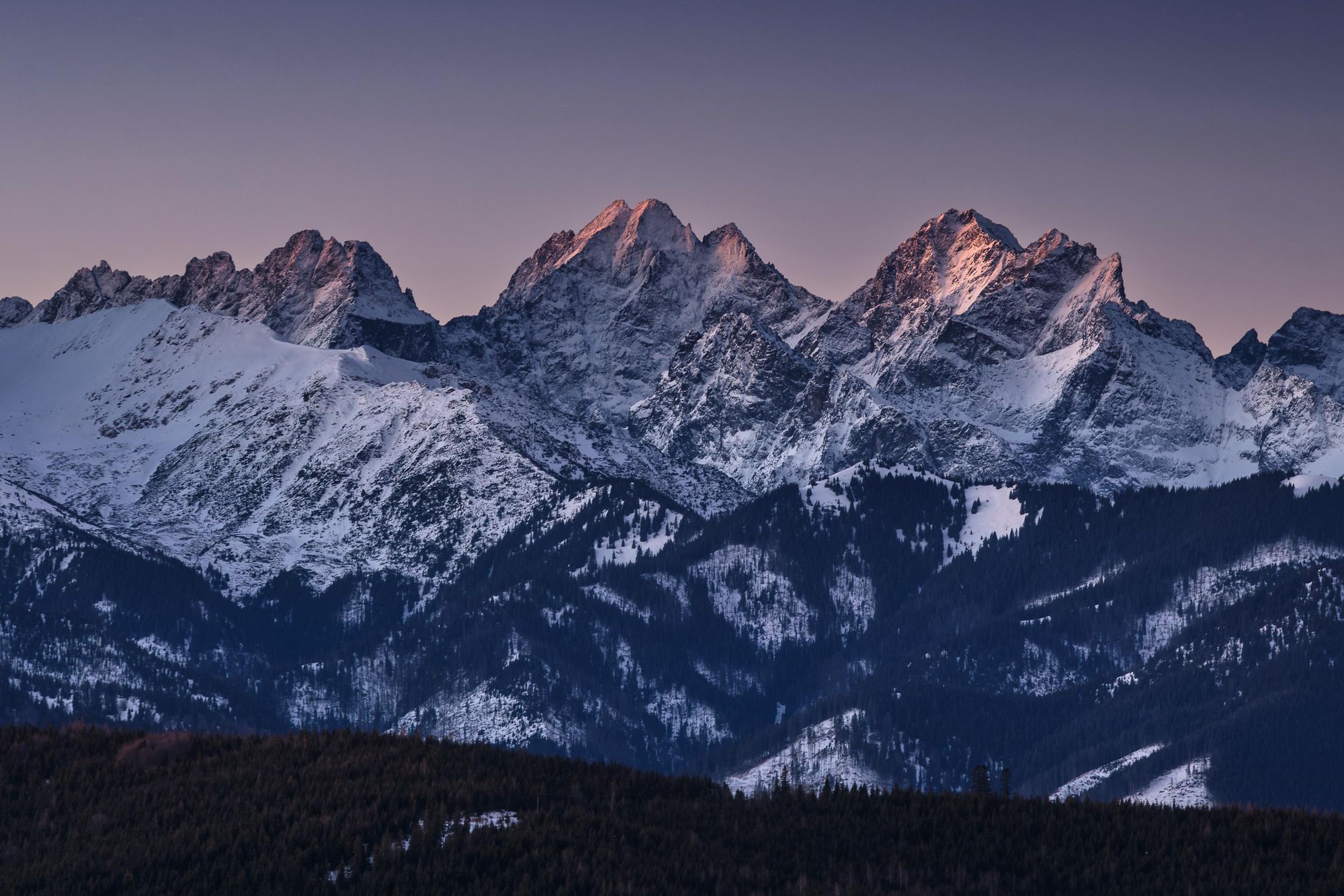 Ganok (2465m), Vysoka (2559m) and Rysy (2501m) in the light of the rising sun in winter. Photo: Getty