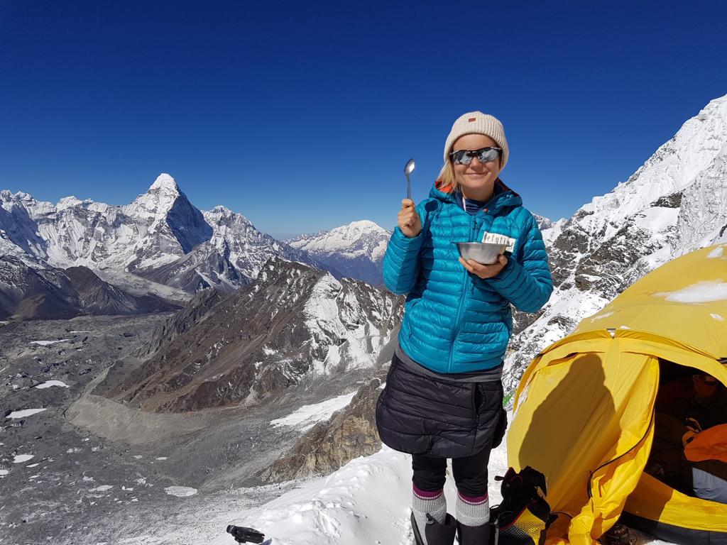 Ibrahimi grabbing breakfast on the ascent of Lhotse, the world's fourth tallest peak. Photo: Uta Ibrahimi